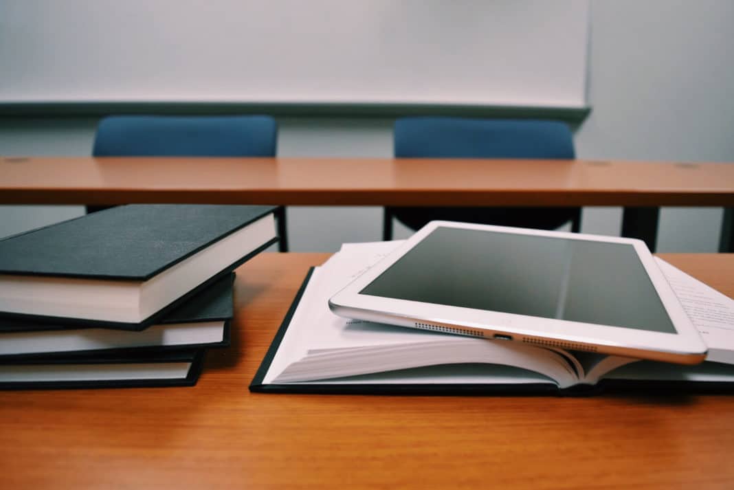 Canva - Tablet and Books on a Desk